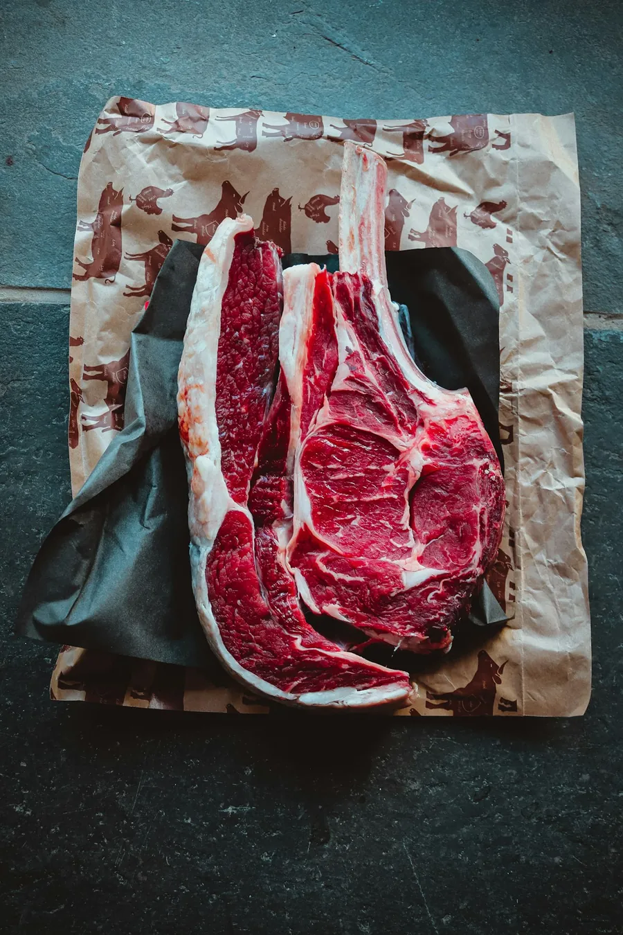 Beef steaks cut and laid out on butcher paper
